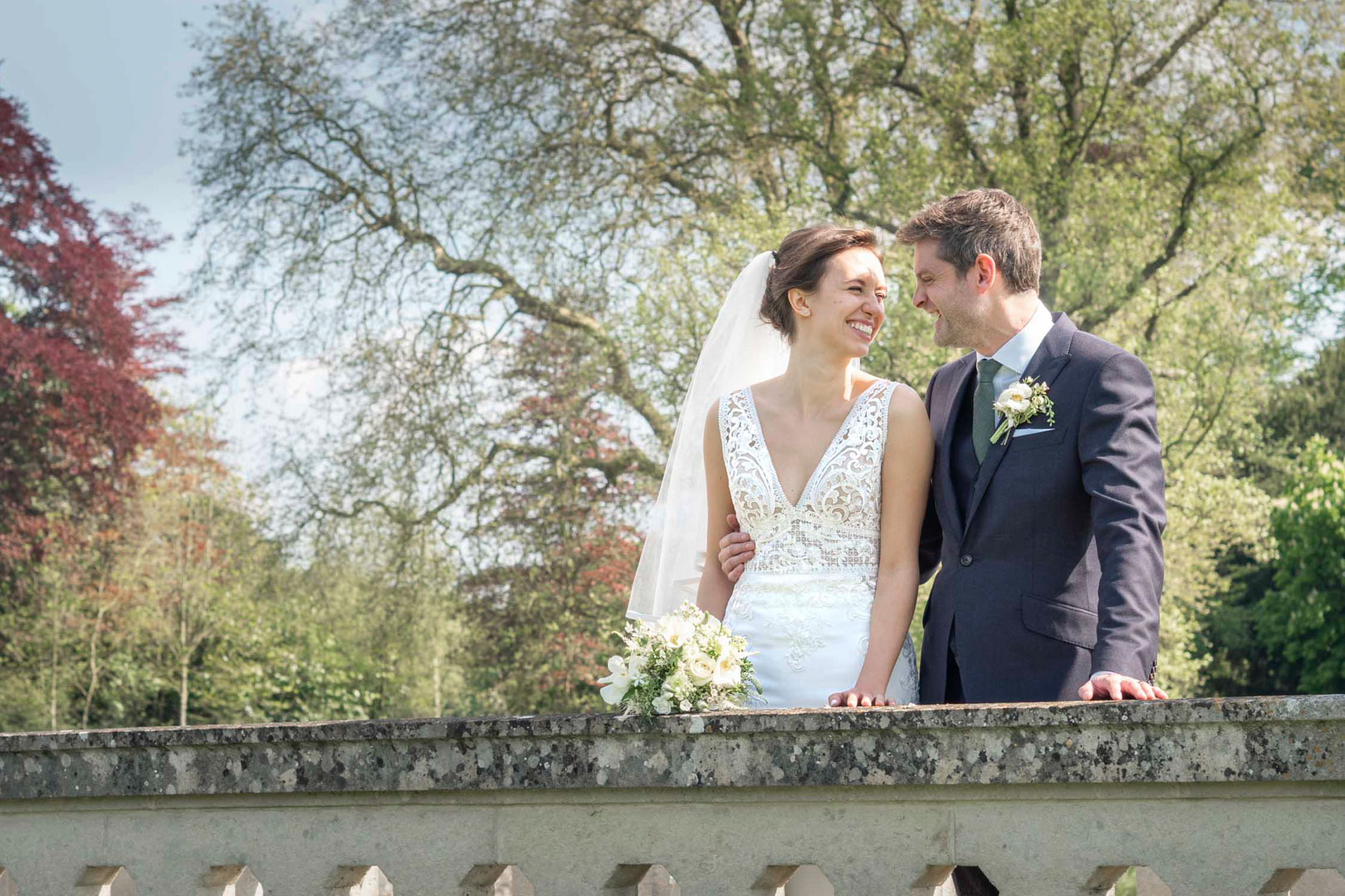 Bride & Groom laugh in the sunshine